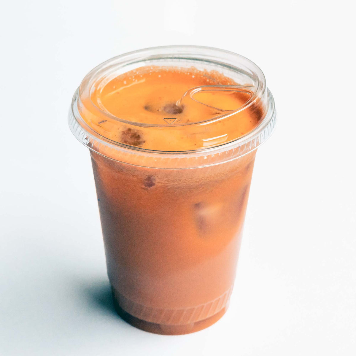 cold cup of Thai tea with lid